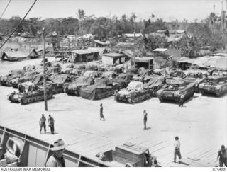 MADANG, NEW GUINEA. 1944-08-23. SOME OF THE CONSIGNMENT OF 32 TANKS WHICH WERE UNLOADED FROM THE AMERICAN LIBERTY SHIP NORMAN S. COLMAN BY THE 7TH DOCKS OPERATING COMPANY. OF THESE 32 TANKS, 3 ..