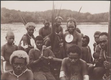 Santa Cruz people going ashore in ship's boat, Graciosa Bay, Solomon Islands, 1906 / J.W. Beattie