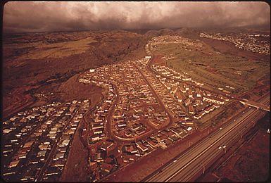 PEARL CITY, ON THE WEST SIDE OF HONOLULU, IS THE FASTEST GROWING AREA IN ALL OF HAWAII. THE STATE ADMINISTRATION WOULD LIKE OAHU RESIDENTS TO CONSIDER MOVING TO THE NEIGHBORING ISLANDS, BUT MEANWHILE THE LAND USE COMMISSION REZONED THIS LAND, ADJOINING AN OLDER DEVELOPMENT, AS APPROPRIATE FOR URBAN DESIGNATION