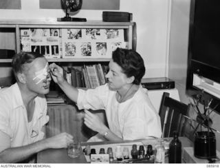 HERBERTON, NSW. 1945-01-30. GUNNER J K LIVINGSTON, (1), SITTING FOR SERGEANT T M POWELL, AUSTRALIAN ARMY MEDICAL WOMEN'S SERVICE, 2/1 FACIO MAXILLARY AND PLASTIC SURGERY UNIT ATTACHED 113 GENERAL ..