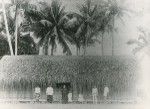 In Tahiti, a native minister and his wife, in front of their house