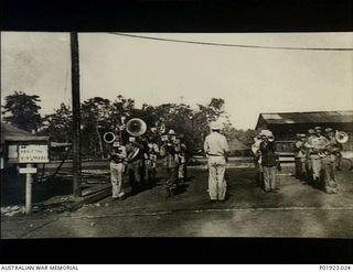 Apoka Valley, Papua. c. 1942-03. The Regimental Band, 135th Medical Regiment, U.S. Army, playing in the grounds of the Port Moresby Evacuation Hospital. In 1942-05 the Regimental Band was posted to ..