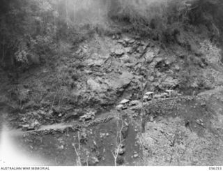 REINHOLD HIGHWAY, NEW GUINEA. 1943-08-25. JEEP CONVOY OF HEADQUARTERS, ROYAL AUSTRALIAN ENGINEERS 11TH AUSTRALIAN DIVISION MOVING DOWN A STEEP SECTION OF THE NEW HIGHWAY SOUTH OF CLOWES CREEK