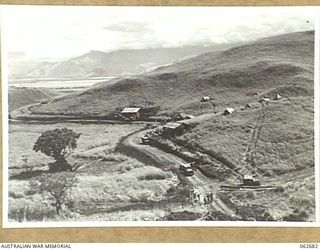 LAKE ROAD, FINISTERRE RANGES, NEW GUINEA. 1943-12-21. SECTION OF THE LAKE ROAD PASSING THE AUSTRALIAN DETAILS ISSUING DEPOT