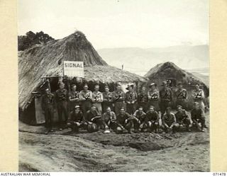 RAMU VALLEY, NEW GUINEA, 1944-03-26. PERSONNEL OF HEADQUARTERS, 15TH INFANTRY BRIGADE SIGNAL SECTION OUTSIDE THE SIGNAL OFFICE. IDENTIFIED PERSONNEL ARE: VX118656 SIGNALMAN C.W. DUGAN (1); VX105686 ..