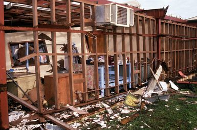 Destroyed buildings display the effects of Typhoon Omar, which struck on August 29th, causing severe damage to Andersen; Naval Station, Guam; and the surrounding area