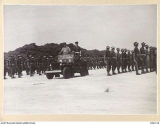 TOROKINA, BOUGAINVILLE. 1945-10-22. A CEREMONIAL PARADE AND MARCH PAST BY 29 INFANTRY BRIGADE WAS HELD FOR MAJOR-GENERAL BRIDGEFORD, GENERAL OFFICER COMMANDING 3 DIVISION, AT TOROKINA AIRFIELD. ..