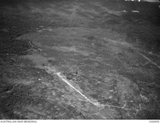 ALEXISHAFEN, NEW GUINEA. 1944-02-27. AERIAL PHOTOGRAPH OF THE JAPANESE-HELD AIRSTRIP AT ALEXISHAFEN ON THE NORTH COAST OF NEW GUINEA SHORTLY BEFORE BEING ATTACKED BY VULTEE VENGEANCE DIVE BOMBER ..