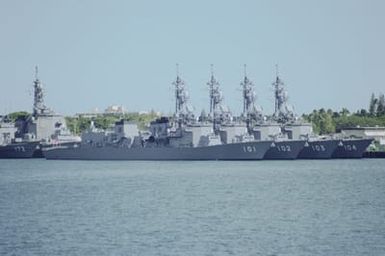View of the Japanese Defense Forces ships of the 1ST Escort Flotilla, Escort Division 48. The ships are JDS MURASAME (DD 101), HARUSAME (DD 102), YUDACHI (DD 103) and KIRISAME (DD 104) tied up at bravo pier no. 22. Astern, partially, visible are the JDS SHIMAKAZE (DDG 172) and JDS KONGO (DDG 173). The ships are here to take part in Operation RIMPAC 2000