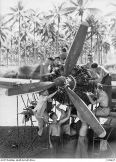 PAPUA-NEW GUINEA AREA. 1944-02-04. SERVICING PARTY AT WORK ON A RAAF DOUGLAS C47 DAKOTA TRANSPORT AIRCRAFT. LEFT TO RIGHT: 13268 LEADING AIRCRAFTMAN (LAC) S. H. SMITH, FISH CREEK, VIC; 33626 LAC E. ..