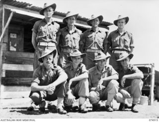 Personnel of No 28 Battery, 2/14th Field Regiment. Identified personnel are: (back row, left to right) SX9139 Gunner (Gnr) G F Smith, VX63107 Gnr L J Brooks, VX32878 Gnr J F Rossack, VX58674 Gnr A ..