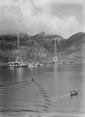 [View of ships docked at a Pacific island]