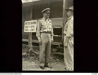 TOROKINA, BOUGAINVILLE ISLAND, SOLOMON ISLANDS. 1945-08-27. 80 GROUP CAPTAIN DIXIE ROBISON CHAPMAN OF ADELAIDE, SA, TALKING TO 265838 FLIGHT LIEUTENANT (FLT LT) C. M. HEMINGWAY OF MOSMAN, NSW, ..