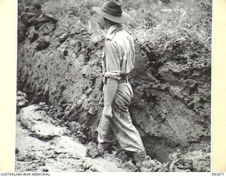 MADANG, NEW GUINEA. 1944-10-12. THE DEPTH OF MUD TRACK MADE BY A CHURCHILL V TANK AT HQ 4 ARMOURED BRIGADE BEFORE ITS RECOVERY