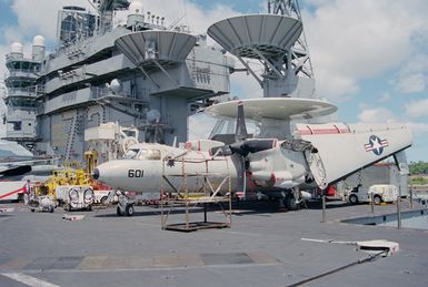 Left front view of a E-2C Hawkeye aircraft from Airborne Early Warning Squadron One-One-Three (VAW-113) the Black Eagles, parked aft of the island on board the nuclear-powered aircraft carrier USS ABRAHAM LINCLON (CVN 72). The LINCOLN is here to take part in Operation RIMPAC 2000