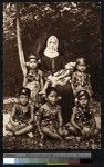 Missionary sister poses with children, Samoa, ca.1900-1930
