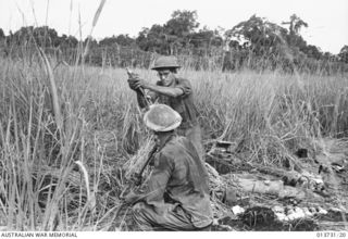 An Australian mortar crew in action during fighting against Japanese forces in the Gona area