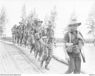 AITAPE, NEW GUINEA, 1944-11-17. A COMPANY, 2/4 INFANTRY BATTALION, 19 INFANTRY BRIGADE, CROSS THE NIGIA RIVER IN MOVEMENT TO THE DRINIUMOR RIVER TO AN ADVANCED POSITION. IDENTIFIED PERSONNEL ARE:- ..
