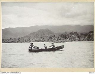 BESAMI BEACH, SALAMAUA AREA, NEW GUINEA. 1945-10-25. WARRANT OFFICER 2 S. WOODWORTH (1), PRIVATE R.E. PIETZNER (2) AND CORPORAL G. MASON (3), MEMBERS OF 2 MARINE FOOD SUPPLY PLATOON, PREPARING TO ..