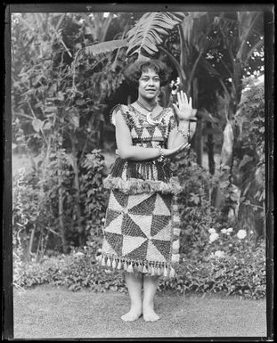 Princess Elisiva Fusipala Tauki'onetuku of Tonga standing in a garden, New South Wales, ca. 1930