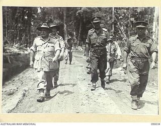 BOUGAINVILLE. 1945-03-26. GEN SIR THOMAS A. BLAMEY, COMMANDER-IN-CHIEF, ALLIED LAND FORCES, SOUTH WEST PACIFIC AREA (1), AMONG SENIOR OFFICERS DURING HIS TOUR OF 7 INFANTRY BRIGADE POSITIONS. ..