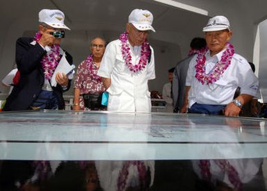 Three World War II Japanese Naval Veterans from the"Unabara Kai"visit the USS ARIZONA Memorial immediately following the joint Navy/National Park Service ceremony commemorating the 65th Anniversary of the attack on Pearl Harbor on Dec. 7, 2006, at Pearl Harbor, Hawaii. More than 1,500 Pearl Harbor survivors, their families and their friends from around the nation joined the more than 2,000 distiguished guests and the general public for the annual observance. (U.S. Navy photo by Mass Communication SPECIALIST 1ST Class James E. Foehl) (Released)