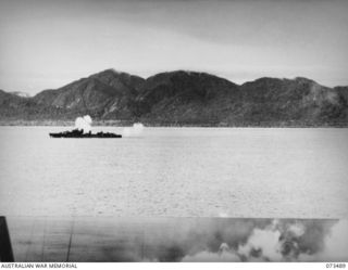 AITAPE, NEW GUINEA. 1944-07. THE DESTROYER HMAS ARUNTA BOMBARDING JAPANESE POSITIONS