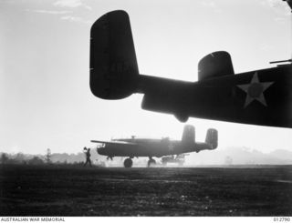 UNITED STATES MEDIUM BOMBER AIRCRAFT TAKE OFF FROM A NEW GUINEA FLYING FIELD TO RAID JAPANESE POSITIONS IN THE PACIFIC. (NEGATIVE BY PARER)