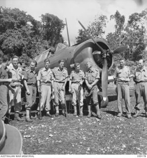 FINSCHHAFEN, NEW GUINEA. 1943-10-30. A GROUP OF OFFICERS OF NO. 4 SQUADRON (ARMY - CO-OPERATION), RAAF WITH THE OFFICER COMMANDING AND THE SECOND IN CHARGE "C" COMPANY, 2/3RD AUSTRALIAN PIONEER ..