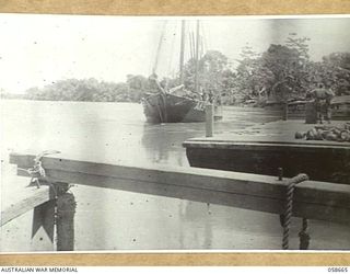 TERAPO, NEW GUINEA, 1943-09-16. KETCH AK94 PULLING IN AT THE AUSTRALIAN MOVEMENT CONTROL WHARF