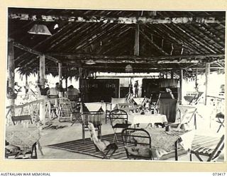 LAE, NEW GUINEA. 1944-05-24. THE INTERIOR OF THE SISTERS' MESS AT THE 2/7TH GENERAL HOSPITAL, VIEWED FROM THE KITCHEN END