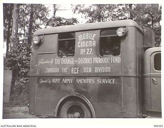 RABAUL, NEW BRITAIN, 1945-11-25. TROOPS IN THE RABAUL AREA ARE PROVIDED WITH ENTERTAINMENT BY MOBILE CINEMAS OF 5 BASE SUB AREA. SHOWN, THE MOBILE CINEMA TRUCK PRESENTED BY THE ORANGE AND DISTRICT ..