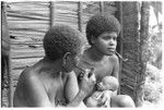 The kwai'okoa'i birth helper and baby sit with Lamana of nearby Maaburu