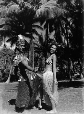 [Portrait of dancing Pacific Island man and woman]