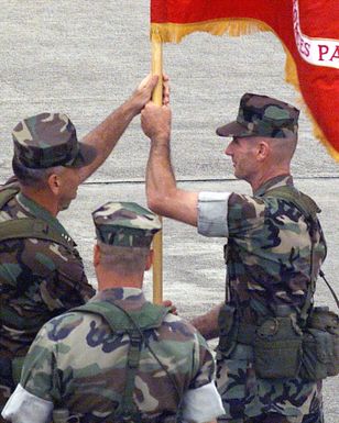 Sergeant Major Mellinger, Sergeant Major Marine Forces Pacific, passes the Marine Forces Pacific Colors to Lieutent General Hailston, Commander Marine Forces Pacific, during the Marine Forces Pacific change of command at Marine Corp Base Hawaii, Kaneohe Bay