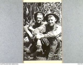 1943-01-22. PAPUA. SANANANDA AREA. TROOPERS E. H. T. POLLARD OF WARWICK, QLD, AND A. J. KELLY OF ESK, QLD, MEMBERS OF 2/7TH CAVALRY REGIMENT, JUST AFTER THEIR RETURN FROM PATROL BEHIND JAPANESE ..