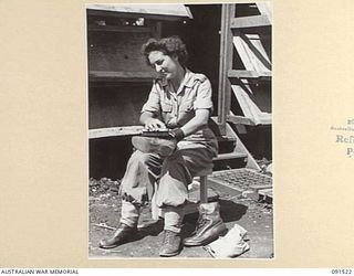 LAE, NEW GUINEA, 1945-05-08. CORPORAL MILLGATE, CLEANING HER BOOTS SHORTLY AFTER ARRIVING AT THE AWAS BARRACKS IN BUTIBUM ROAD. SHE IS ONE OF A GROUP OF 342 AWAS WHO TRAVELLED ON THE MV DUNTROON ..