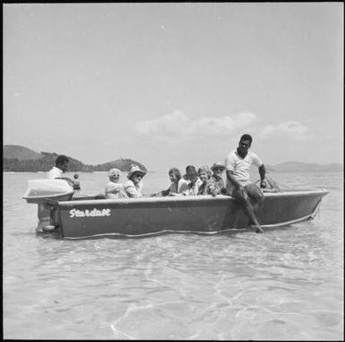Tourists sitting in a motorboat, Vanua Levu, Fiji, November 1966 / Michael Terry