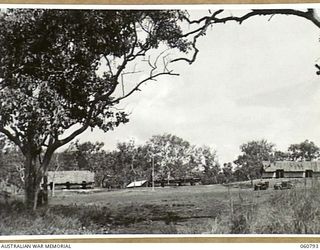 POM POM VALLEY, NEW GUINEA. 1943-11-27. VIEW OF HEADQUARTERS, 18TH AUSTRALIAN INFANTRY BRIGADE LOOKING ACROSS THE PARADE GROUND