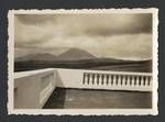 View of mountains from a balcony with cement railings, New Zealand?