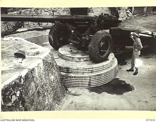 PORT MORESBY, PAPUA, NEW GUINEA. 1944-03-27. THE NO 1 GUN EMPLACEMENT AT BOOTLESS BATTERY, COAST ARTILLERY SHOWING THE CONCRETE CONSTRUCTION OF THE PIVOT MOUNTING ON WHICH THE 155MM M1917 GUN IS ..