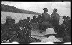 Group of people on small boat, in Graciosa bay, Santa Cruz Islands