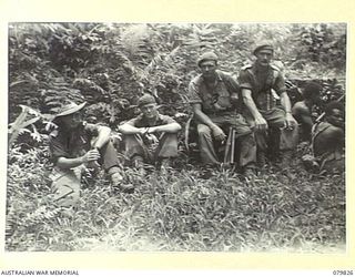 BOUGAINVILLE AREA, SOLOMON ISLANDS. 1945-03-25. OFFICERS WORKING WITH A RAIDING PARTY OF NO.5 PLATOON, A COMPANY, 1ST NEW GUINEA INFANTRY BATTALION ATTACHED TO THE 7TH INFANTRY BRIGADE, OPERATING ..