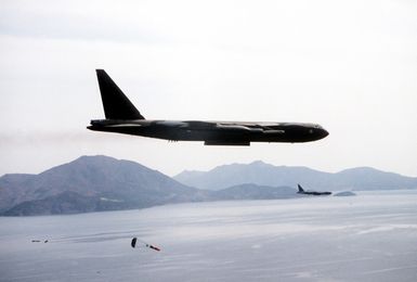 A right side view of two B-52 bomber aircraft from Anderson Air Base, Guam, dropping mines during Exercise Team Spirit '82