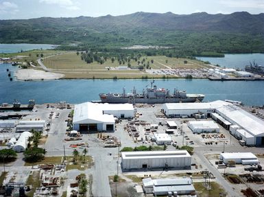 A port beam view of the combat stores ship USS SAN JOSE (AFS 7) moored at the US Naval Ship Repair Facility