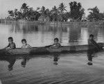 Children in a canoe, Fiji