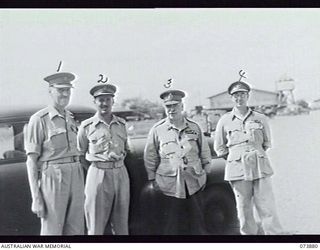 LAE, NEW GUINEA. 1944-06-18. VX1 GENERAL SIR THOMAS BLAMEY CBE, KCB, CMG, DSO, ED, WITH SENIOR OFFICERS AT THE AIRFIELD DURING HIS ARRIVAL AT HEADQUARTERS NEW GUINEA FORCE. LEFT TO RIGHT: VX14 ..