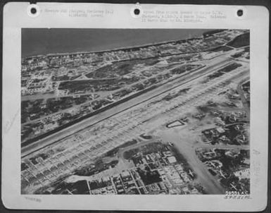 B-29S Of The 20Th Af Assembled On Baker Runway, Saipan, Marianas Islands To Load Food And Clothing To Be Dropped To Pw Camps. [314Th Bombardment Wing] (U.S. Air Force Number 59551AC)