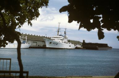 A port bow view of the National Oceanic and Atmospheric Administration research ship Oceanographer (R 101) moored at a commercial pier