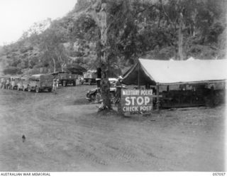 ROUNA, NEW GUINEA. 1943-09-18. ROUNA TRANSPORT CONTROL POINT NO. 1 IS NEAR THE PORT MORESBY END OF THE PORT MORESBY-ROUNA ROAD. THIS CONTROL POINT, MANNED BY SERVICE POLICE, CONTROLS TRANSPORT ..